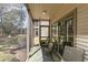 Relaxing screened porch with comfortable seating, perfect for enjoying the outdoors in comfort at 478 Pinehurst Ln. # 17D, Pawleys Island, SC 29585