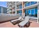 Spacious balcony with lounge chairs, perfect for enjoying sunny days and ocean breezes at 5300 N Ocean Blvd. # 708, Myrtle Beach, SC 29577