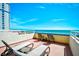 Relax on the balcony with ocean views and seating for outdoor living at 5300 N Ocean Blvd. # 708, Myrtle Beach, SC 29577