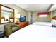 Cozy bedroom with two beds, a television, a mirror and a comfortable chair at 5300 N Ocean Blvd. # 708, Myrtle Beach, SC 29577