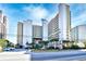 A beautiful view of the condos, lush greenery, and palm trees, a tranquil haven at 5300 N Ocean Blvd. # 708, Myrtle Beach, SC 29577