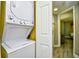 Convenient in-unit laundry room with a stackable washer and dryer at 5300 N Ocean Blvd. # 708, Myrtle Beach, SC 29577