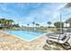 Enjoy this outdoor swimming pool with lounge chairs, and palm trees in a fenced area at 5300 N Ocean Blvd. # 708, Myrtle Beach, SC 29577