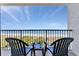 Balcony view of the sandy beach and ocean featuring two chairs for relaxing and taking in the scenery at 5308 N Ocean Blvd. # 503, Myrtle Beach, SC 29577