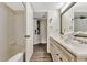 Bathroom with a single sink vanity, mirror, bath tub and toilet at 5308 N Ocean Blvd. # 503, Myrtle Beach, SC 29577