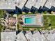 Birds-eye view of a community pool and deck with loungers, surrounded by condos and lush landscaping at 5601 N Ocean Blvd. # C-311, Myrtle Beach, SC 29577
