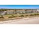 Beautiful aerial shot showcasing condos near a beach with a dune and pedestrian crosswalk for easy beach access at 5601 N Ocean Blvd. # C-311, Myrtle Beach, SC 29577