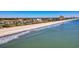 Scenic aerial view of condo buildings lining a sandy beach with gentle waves, showcasing coastal living at its finest at 5601 N Ocean Blvd. # C-311, Myrtle Beach, SC 29577
