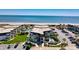 Aerial shot of oceanfront condos with a community pool, manicured landscaping, and convenient parking near the beach at 5601 N Ocean Blvd. # C-311, Myrtle Beach, SC 29577
