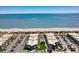 Overhead view of condos with a pool, palm trees, and ample parking, near a beautiful beach and ocean at 5601 N Ocean Blvd. # C-311, Myrtle Beach, SC 29577