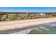 Expansive coastal view featuring condos, a pristine beach, and the glistening ocean under a clear blue sky at 5601 N Ocean Blvd. # C-311, Myrtle Beach, SC 29577