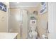Small bathroom featuring a glass enclosed shower, toilet and small vanity at 5601 N Ocean Blvd. # C-311, Myrtle Beach, SC 29577