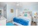 Inviting bedroom with coastal accents, bed, and access to additional room at 5601 N Ocean Blvd. # C-311, Myrtle Beach, SC 29577