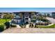 Exterior view of a condo building with pool and palm trees near the ocean at 5601 N Ocean Blvd. # C-311, Myrtle Beach, SC 29577