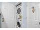 Efficiently designed laundry closet with stacked washer and dryer units at 5601 N Ocean Blvd. # C-311, Myrtle Beach, SC 29577