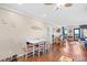 Dining and living room area with wood floors, nautical decor, and balcony access with ocean view at 5601 N Ocean Blvd. # C-311, Myrtle Beach, SC 29577