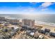 Breathtaking aerial view showcases the oceanfront resort and coastal neighborhood, with the sandy beach at 5700 N Ocean Blvd. # 1107, North Myrtle Beach, SC 29582