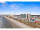 An aerial view showcasing the beachfront location of this condo community at 5700 N Ocean Blvd. # 1107, North Myrtle Beach, SC 29582