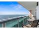 Balcony view with ocean views, clear skies and lounge chairs at 5700 N Ocean Blvd. # 1107, North Myrtle Beach, SC 29582