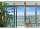 Ocean view from balcony with patio furniture and decor at 5700 N Ocean Blvd. # 1107, North Myrtle Beach, SC 29582