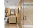 Bright bathroom features a vanity and tiled walk-in shower at 5700 N Ocean Blvd. # 1107, North Myrtle Beach, SC 29582