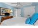 Comfortable bedroom with light blue walls and white trim at 5700 N Ocean Blvd. # 1107, North Myrtle Beach, SC 29582