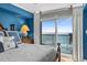 Bedroom with water view, king size bed, and accent pillows at 5700 N Ocean Blvd. # 1107, North Myrtle Beach, SC 29582