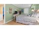 Cozy bedroom with beachy art and light-colored wood floors at 5700 N Ocean Blvd. # 1107, North Myrtle Beach, SC 29582