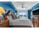 Bright bedroom featuring a king bed and ocean views from a private balcony at 5700 N Ocean Blvd. # 1107, North Myrtle Beach, SC 29582
