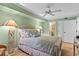 Bedroom with woven furniture, carpet and coastal decor at 5700 N Ocean Blvd. # 1107, North Myrtle Beach, SC 29582