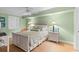 Bright, calming bedroom featuring a ceiling fan and serene green walls at 5700 N Ocean Blvd. # 1107, North Myrtle Beach, SC 29582
