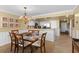 An open dining area showcasing seating for six and updated kitchen at 5700 N Ocean Blvd. # 1107, North Myrtle Beach, SC 29582