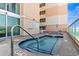 Inviting rooftop hot tub with sparkling blue tile and convenient access in an attractive outdoor living area at 5700 N Ocean Blvd. # 1107, North Myrtle Beach, SC 29582