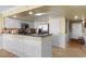 A modern kitchen with stainless steel appliances and white cabinetry at 5700 N Ocean Blvd. # 1107, North Myrtle Beach, SC 29582