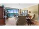 A well-lit living room with ocean views and modern furniture at 5700 N Ocean Blvd. # 1107, North Myrtle Beach, SC 29582