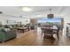 Open lounge with couches, chairs, and dining table is the perfect communal gathering place at 5700 N Ocean Blvd. # 1107, North Myrtle Beach, SC 29582