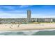 Scenic aerial view highlighting the high-rise building near a beach and RV campsites at 5905 South Kings Hwy. # 1708, Myrtle Beach, SC 29575
