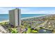 Expansive aerial view showcasing beachfront high-rise condos, a large campground, and the coastline at 5905 South Kings Hwy. # 1708, Myrtle Beach, SC 29575