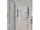 Bright hallway featuring neutral tile flooring, leading to a bedroom with ample natural light at 5905 South Kings Hwy. # 1708, Myrtle Beach, SC 29575