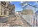 Backyard featuring a shed, stone walkway, and an enclosed staircase at 600-B 43Rd Ave. S, North Myrtle Beach, SC 29582