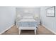 A peaceful bedroom with a queen bed and a matching nightstand on either side at 600-B 43Rd Ave. S, North Myrtle Beach, SC 29582