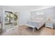 Bright bedroom with a queen bed and sliding glass door to the outdoor seating area at 600-B 43Rd Ave. S, North Myrtle Beach, SC 29582