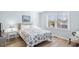 Charming bedroom featuring a decorative nautical-themed bedspread and bright natural light from the window at 600-B 43Rd Ave. S, North Myrtle Beach, SC 29582