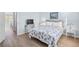 Tastefully decorated bedroom featuring a comfortable bed, stylish furniture, and a view into an additional bedroom at 600-B 43Rd Ave. S, North Myrtle Beach, SC 29582