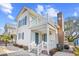 Charming two-story beach home with a second story balcony and nicely landscaped front yard at 600-B 43Rd Ave. S, North Myrtle Beach, SC 29582