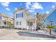 Exterior elevation showcasing a charming home with a balcony at 600-B 43Rd Ave. S, North Myrtle Beach, SC 29582