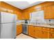 Well-lit kitchen with stainless steel appliances, wooden cabinets, and granite countertops at 600-B 43Rd Ave. S, North Myrtle Beach, SC 29582