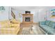 Inviting living room featuring a fireplace, laminate flooring, and access to the entryway and stairs at 600-B 43Rd Ave. S, North Myrtle Beach, SC 29582