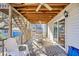 Outdoor porch with cozy seating and a table for dining, overlooking the yard and surrounding area at 600-B 43Rd Ave. S, North Myrtle Beach, SC 29582