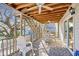 Relaxing porch featuring comfortable seating and a dining area, perfect for enjoying the outdoor scenery at 600-B 43Rd Ave. S, North Myrtle Beach, SC 29582